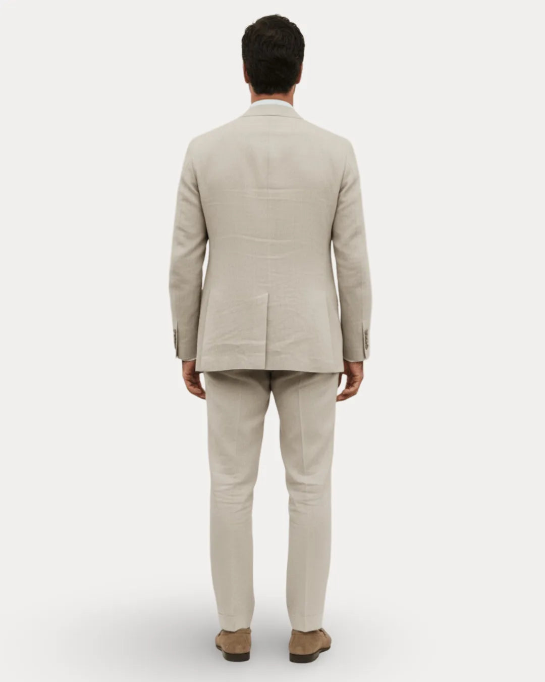 Back view of the beige linen suit highlighting the natural linen texture and tailored silhouette