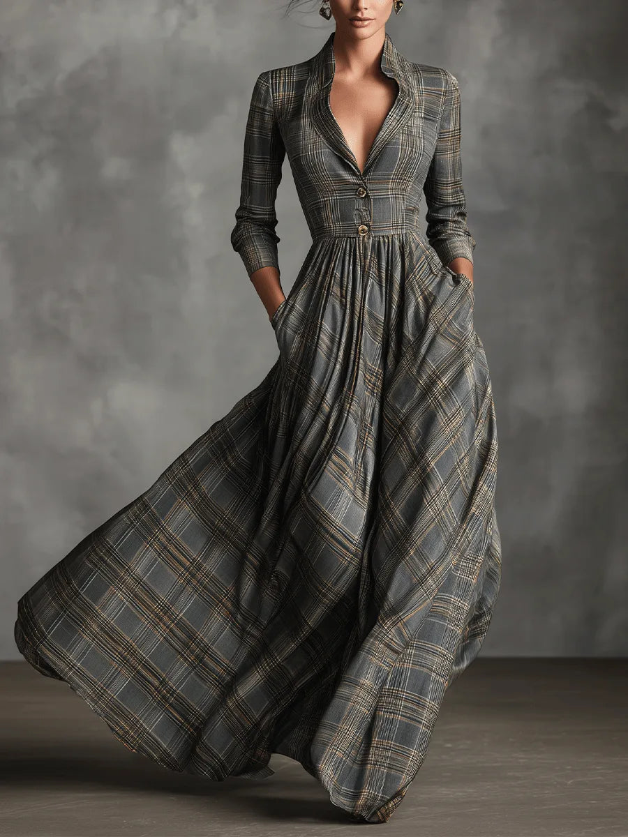 Front view of a grey tartan maxi dress with notched collar, V-neckline, button front bodice and flared skirt with pockets