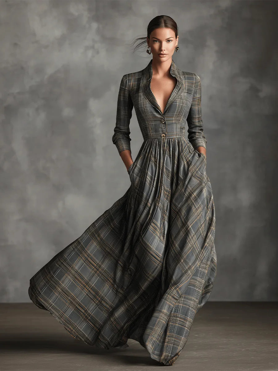 Full-length front view of the grey tartan maxi dress captured mid-movement, showing the sweep of the flared hem