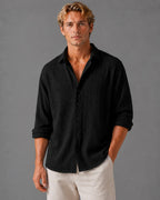 Close front view of textured cotton shirt showing crinkled fabric weave and classic collar