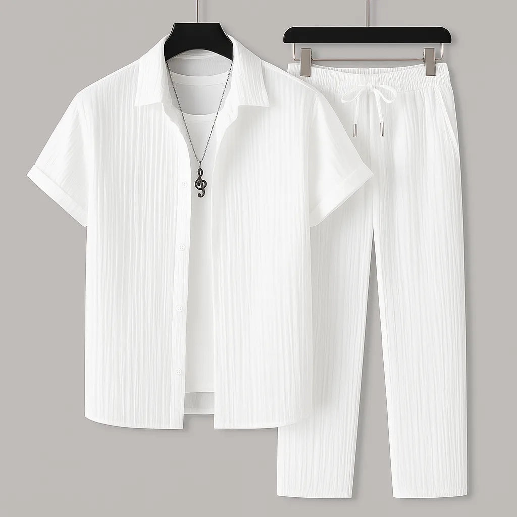 White textured short-sleeve shirt and drawstring trousers set shown on hangers with a layered white tee and pendant