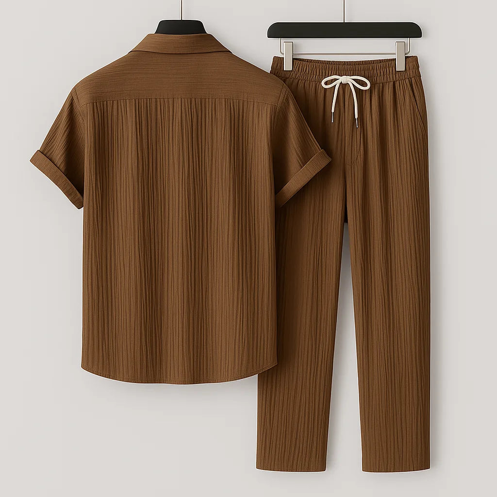 Back view of the brown ribbed short-sleeve shirt and matching trousers, highlighting the collar and rolled cuffs