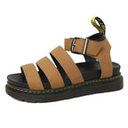 Tan platform sandal with triple straps and adjustable ankle buckle, shown against a plain background