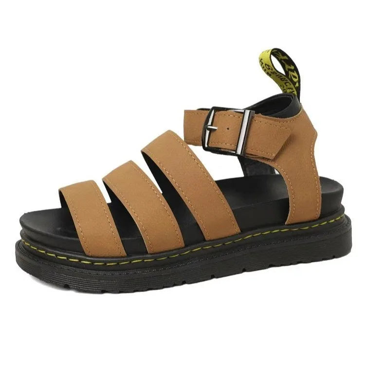 Tan platform sandal with triple straps and adjustable ankle buckle, shown against a plain background
