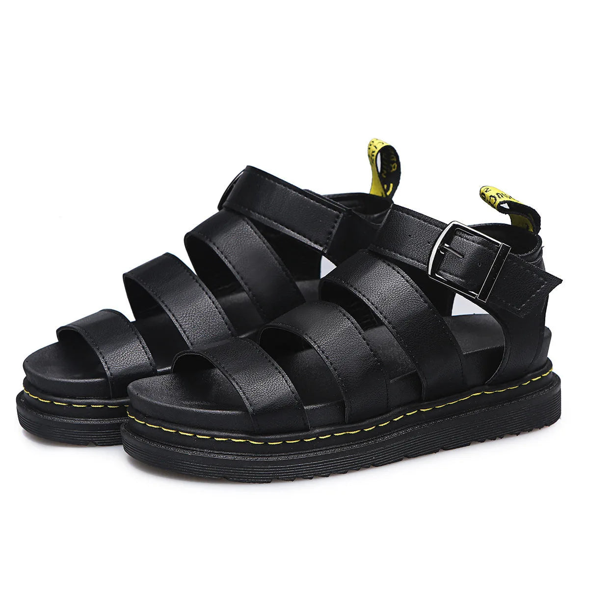 Pair of black platform sandals arranged together showing the full triple strap design and buckle detail