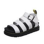 White platform sandal viewed from the side angle, highlighting the open toe and buckled ankle strap