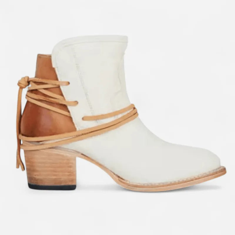 Side profile of cream leather ankle boot with contrasting tan heel counter and leather wrap laces