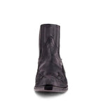 Front view close-up of a black leather western ankle boot showing V-shaped seam and pointed toe