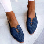 Navy blue woven leather flats with pointed toe, slingback heel and scalloped lace-up front